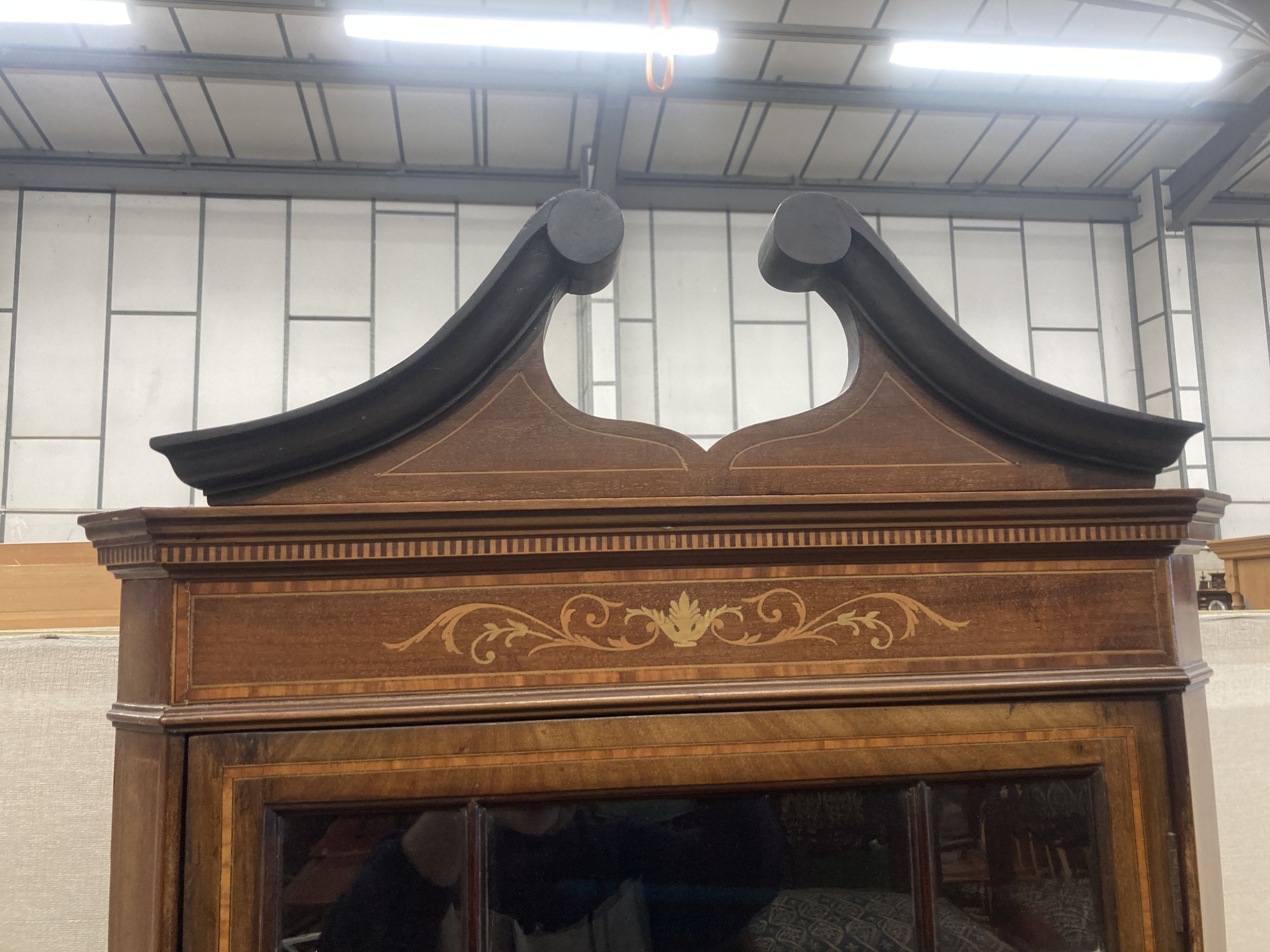 An Edwardian marquetry inlaid and cross banded mahogany standing corner cabinet, width 70cm, depth 40cm, height 205cm